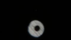 Jupiter. This image is out of focus. (Ignore the black spot in the centre) But you can just make out Jupiter's rings