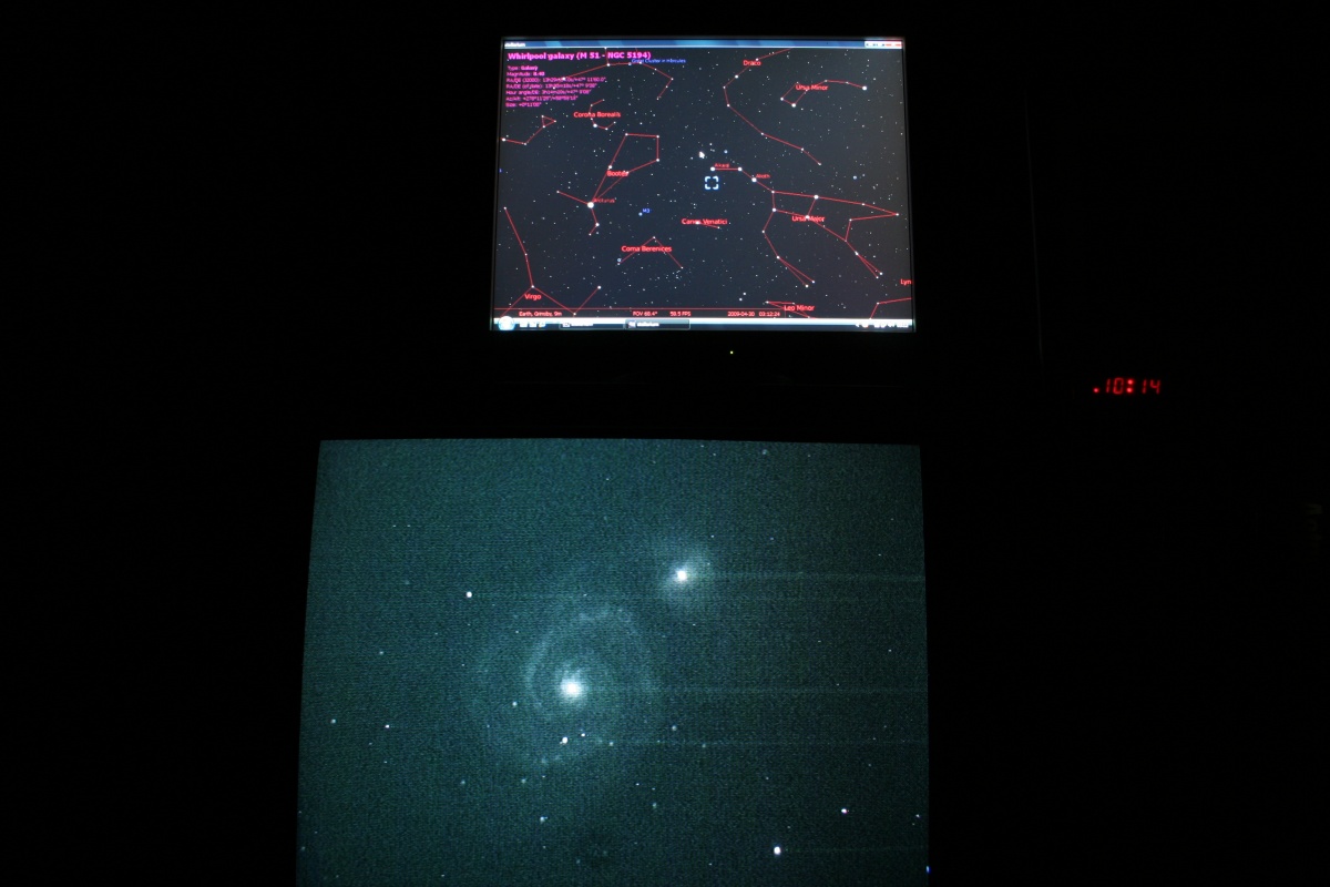 Live TV image of M51 the Whirlpool Galaxy in Canes Venatici. Stellarium showing location on monitor above