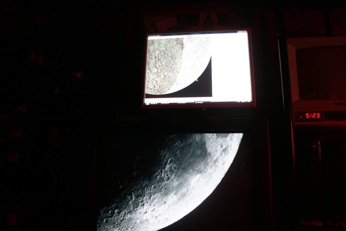 Live TV image of the crescent moon with Virtual Moon Atlas running on the monitor above